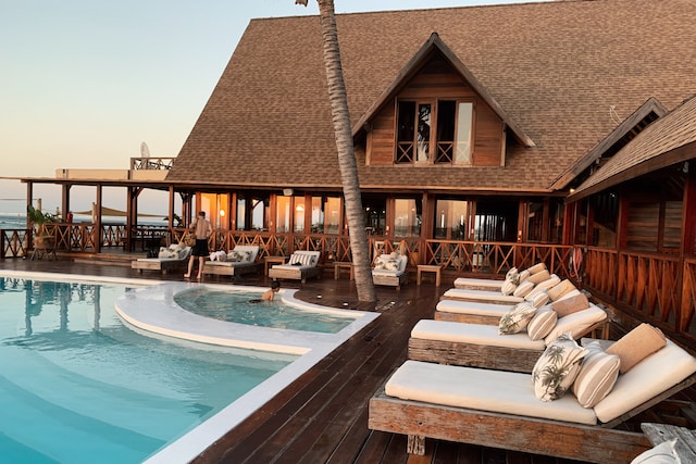 Hotel with a pool and sun loungers